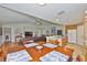 Bright living area combining dining and living space with hardwood floors and open access to the kitchen at 11622 Summit Rock Ct, Parrish, FL 34219