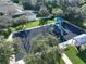 Aerial view of a neighborhood playground featuring swings, slides, and a covered picnic area at 11622 Summit Rock Ct, Parrish, FL 34219