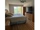 Main bedroom with large windows and wood floors at 3780 Lake Bayshore Dr # K-521, Bradenton, FL 34205