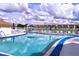 Community pool with plenty of lounge chairs at 3780 Lake Bayshore Dr # K-521, Bradenton, FL 34205