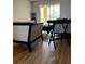 Living room with laminate flooring and access to a balcony at 3780 Lake Bayshore Dr # K-521, Bradenton, FL 34205