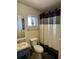 Clean bathroom with shower/tub combo and gray vanity at 3780 Lake Bayshore Dr # K-521, Bradenton, FL 34205