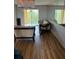 Living room with laminate flooring and access to a balcony at 3780 Lake Bayshore Dr # K-521, Bradenton, FL 34205