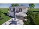 Two-story modern home with gray garage door and balcony at 2516 Browning St, Sarasota, FL 34237