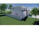 Two-story house with modern gray exterior, fenced backyard, and balcony at 2516 Browning St, Sarasota, FL 34237
