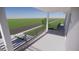 Private balcony overlooking a tree-lined street at 2516 Browning St, Sarasota, FL 34237