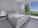 Spacious bedroom with a king-size bed and private balcony access at 2516 Browning St, Sarasota, FL 34237