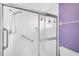 Bathroom shower with glass doors, safety handles and built in shelf at 4223 Murfield E Dr, Bradenton, FL 34203