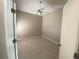 Clean bedroom featuring tiled floors and a ceiling fan, providing a cool and comfortable space at 4223 Murfield E Dr, Bradenton, FL 34203