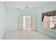 Bright bedroom with tile flooring, ceiling fan, and view to the outdoors at 4223 Murfield E Dr, Bradenton, FL 34203