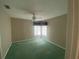 Cozy bedroom featuring a ceiling fan and a window that allows natural light to fill the space at 4223 Murfield E Dr, Bradenton, FL 34203
