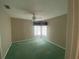 Bedroom with a ceiling fan and large windows at 4223 Murfield E Dr, Bradenton, FL 34203