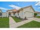 Beautiful single-story home featuring a terracotta roof and lush, green lawn at 4223 Murfield E Dr, Bradenton, FL 34203