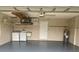 Functional garage space featuring laundry appliances, ample storage, and room for parking at 4223 Murfield E Dr, Bradenton, FL 34203