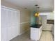 Kitchen featuring white appliances and a black island, offering both functionality and style at 4223 Murfield E Dr, Bradenton, FL 34203