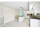 Open kitchen with a central island, white cabinets, and a breakfast nook area at 4223 Murfield E Dr, Bradenton, FL 34203