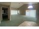 Spacious living room with high ceilings, a ceiling fan, and large windows providing natural light at 4223 Murfield E Dr, Bradenton, FL 34203