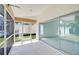 Enclosed patio featuring access to the backyard and an entrance to the living space at 4223 Murfield E Dr, Bradenton, FL 34203