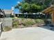 Backyard with exposed concrete blocks and a partial view of the building at 6831 Georgia Ave, Bradenton, FL 34207