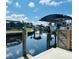 Dock with boat and lift, located on a canal with nearby homes at 6831 Georgia Ave, Bradenton, FL 34207