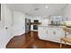 Bright kitchen showcasing white cabinetry, granite countertops and hardwood floors at 1711 Starling Dr # 1711, Sarasota, FL 34231