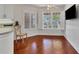 Kitchen nook with wood floors and built-in window seat at 1711 Starling Dr # 1711, Sarasota, FL 34231