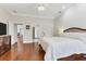 Bright bedroom with hardwood floors and access to en-suite bathroom at 1711 Starling Dr # 1711, Sarasota, FL 34231