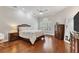 Main bedroom with hardwood floors and plenty of natural light at 1711 Starling Dr # 1711, Sarasota, FL 34231