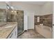Spa-like bathroom with granite vanity and a large shower at 1711 Starling Dr # 1711, Sarasota, FL 34231