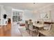 Open concept dining area with hardwood floors, chandelier and access to the living room at 1711 Starling Dr # 1711, Sarasota, FL 34231