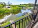 Stunning view of canal, boats, and lush greenery from balcony at 4212 126Th W St # 409, Cortez, FL 34215