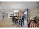 Bright dining room with table, chairs, and chandelier, offering access to balcony at 301 S Gulfview Blvd # 301, Clearwater Beach, FL 33767