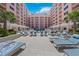 Ground level view of the resort pool and building at 301 S Gulfview Blvd # 301, Clearwater Beach, FL 33767