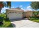 One story home with a two car garage, and nicely landscaped yard at 4140 Reflections Pkwy, Sarasota, FL 34233
