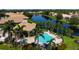 Resort-style pool and clubhouse with lake views at 4140 Reflections Pkwy, Sarasota, FL 34233