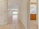 Bright hallway with tile floors and access to living areas at 4140 Reflections Pkwy, Sarasota, FL 34233