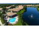 Community pool and clubhouse with lake access at 4140 Reflections Pkwy, Sarasota, FL 34233