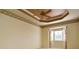 Spacious bedroom with tray ceiling and carpeting at 4140 Reflections Pkwy, Sarasota, FL 34233