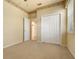 Bedroom with neutral walls, carpet flooring and double door closet at 4140 Reflections Pkwy, Sarasota, FL 34233