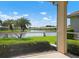 Relaxing screened lanai overlooking a peaceful lake at 4140 Reflections Pkwy, Sarasota, FL 34233