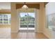 Kitchen with sliding doors to patio and water view at 4140 Reflections Pkwy, Sarasota, FL 34233