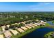 Aerial view of home near the lake at 4140 Reflections Pkwy, Sarasota, FL 34233