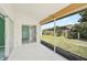 Spacious screened porch with access to the backyard and interior of the home at 4223 Murfield E Dr, Bradenton, FL 34203