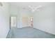 Large bedroom with light walls, carpeting, and access to a bathroom and hallway at 4223 Murfield E Dr, Bradenton, FL 34203
