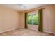 Comfortable bedroom with neutral tones, large window, and plush carpet providing a tranquil space at 4830 Maymont Park Cir, Bradenton, FL 34203