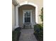 Charming front porch with a decorative bench, adding a welcoming touch to the home's facade at 4830 Maymont Park Cir, Bradenton, FL 34203