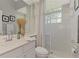 Clean bathroom with shower, vanity, and decorative accents at 9044 Misty Creek Dr, Sarasota, FL 34241