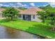 Backyard with screened patio, overlooking a canal at 3207 77Th E Dr, Sarasota, FL 34243