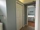 Hallway with access to bedroom and linen closet at 3207 77Th E Dr, Sarasota, FL 34243