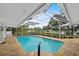 Inviting screened pool area with expansive patio at 5531 Contento Dr, Sarasota, FL 34242